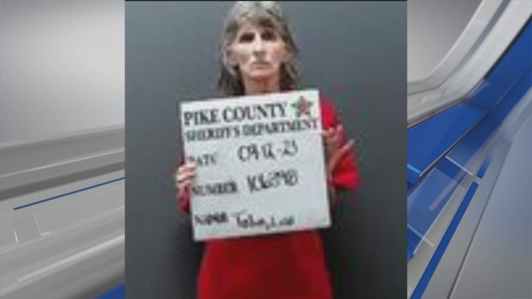 A woman has been arrested in connection with a murder in Pike County