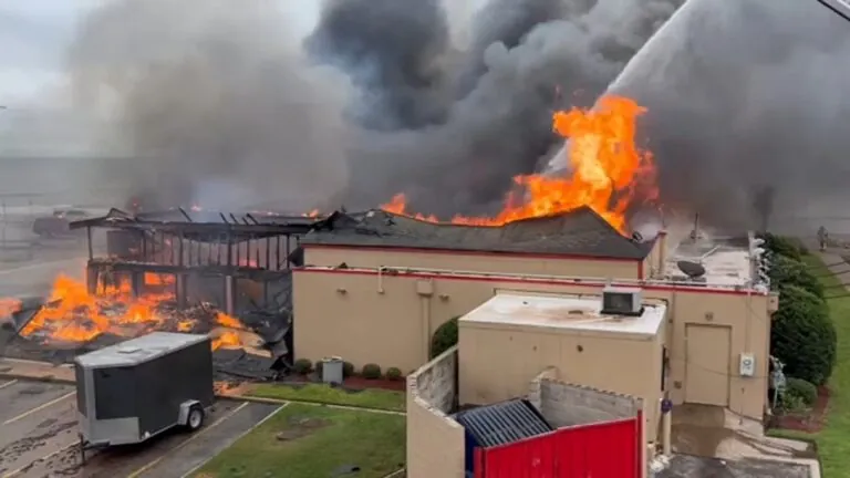 Officials say high winds in Galveston led to the demolition of Denny’s restaurant after it caught fire