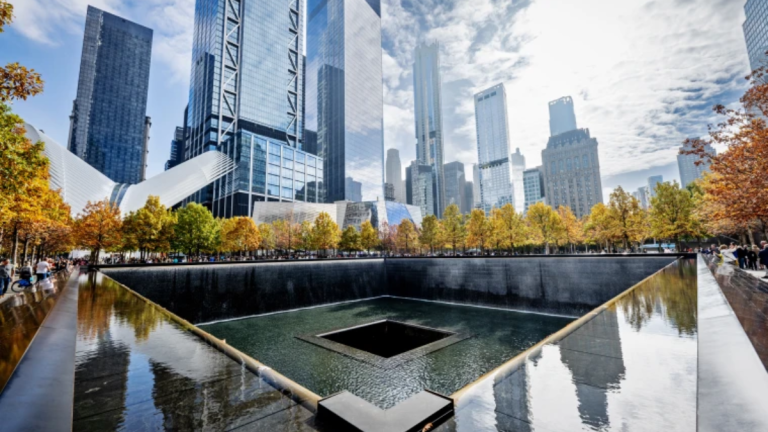 A person dives into the reflecting pool located in the 9/11 Memorial premises in New York City.
