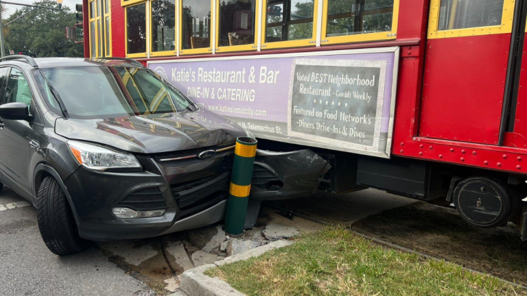 Streetcar and car collide on Canal Street in New Orleans