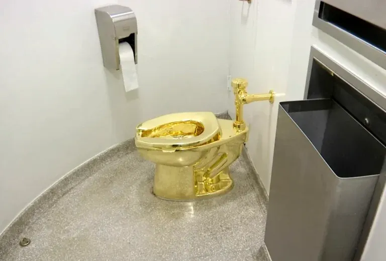 Four individuals charged with stealing an 18-karat gold toilet