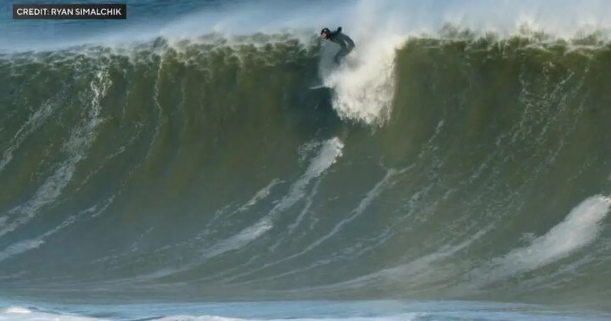 Photographers and surfers marvel at the massive waves on the Jersey Shore
